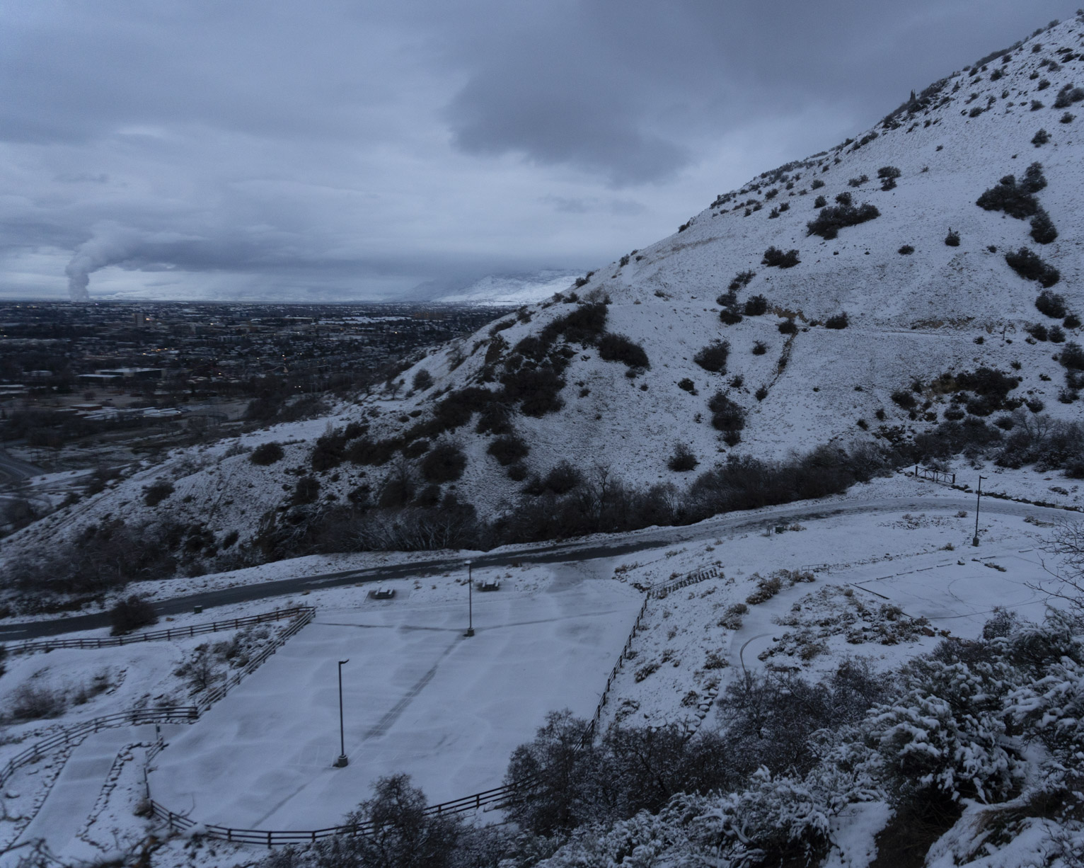 The town visible beyond the mountain and parking lot at slate canyon all covered in recent snow